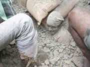 A man trapped in rubble after an earthquake devastated Nepal on April 25, 2015. (Source: Twitter)